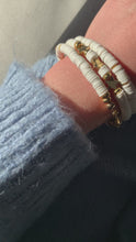 Load and play video in Gallery viewer, Bracelet With White Heishi Beads And Gold Plated Stars