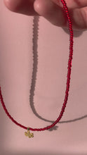 Load and play video in Gallery viewer, Red Necklace With Snowflake Pendant