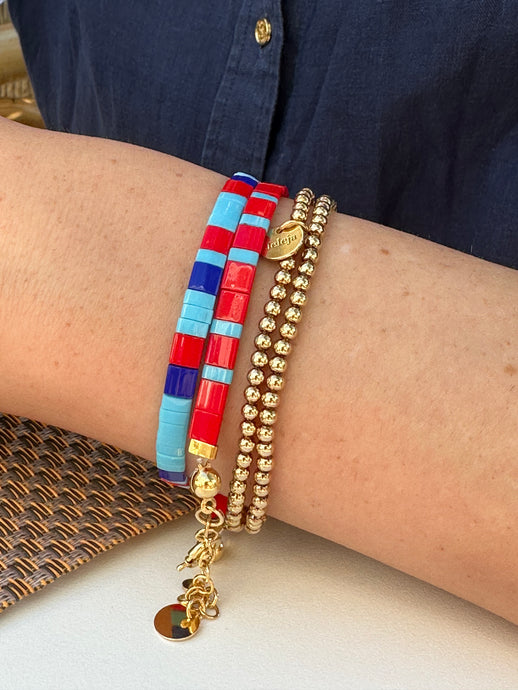 Red, blue and gold bracelets with Tila beads.
