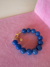 Load image into Gallery viewer, Hand assembled bracelet with blue agate beads and gold details
