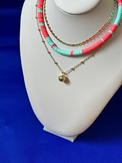 Three layers of necklaces with golden parts or colorful  heishi beads